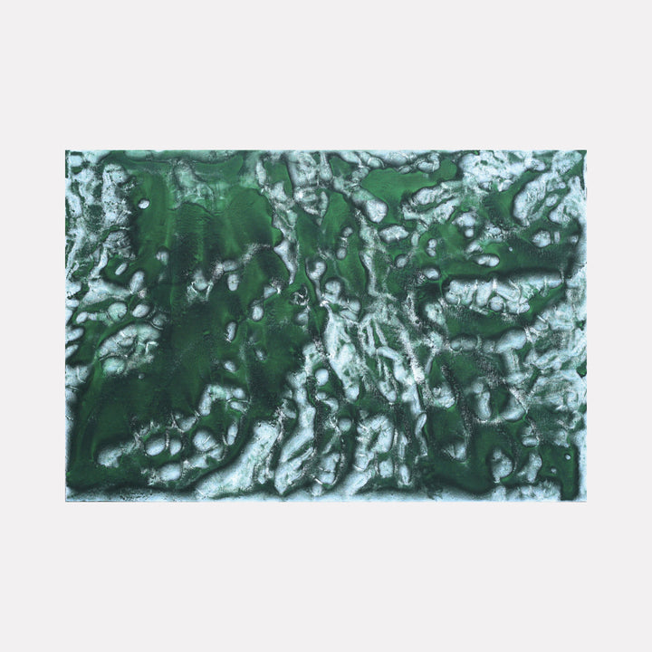 The artwork 'Biophilia 3' by George Stanojevic features an abstract organic composition with rich emerald green tones interweaving with silvery white streaks, creating a dynamic topographical pattern. The textural elements suggest natural formations, with fluid movements resembling aerial views of landscapes, achieved through the interaction of pigments and environmental elements on canvas.