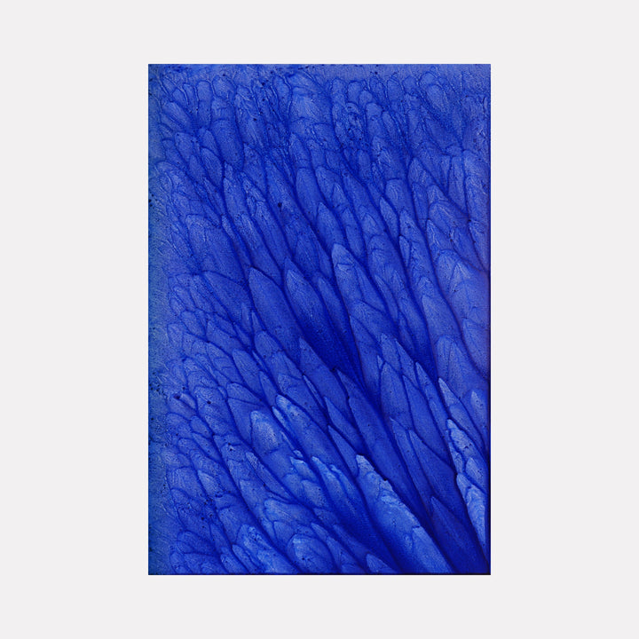 The artwork 'Biophilia 24' by George Stanojevic features vibrant cobalt blue organic patterns resembling flowing water or tree branches, created through natural elements on canvas. Deep textural ridges and valleys form a dynamic abstract composition with varying shades of ultramarine, creating a mesmerizing ripple effect across the surface.