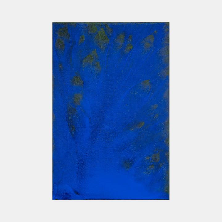 The artwork 'Biophilia 26' by George Stanojevic features a striking deep cobalt blue canvas with organic shadowy patterns and textural elements created through natural processes. Dark scattered marks and ethereal variations in the blue pigment suggest movement and depth, influenced by environmental elements like sunlight and water.