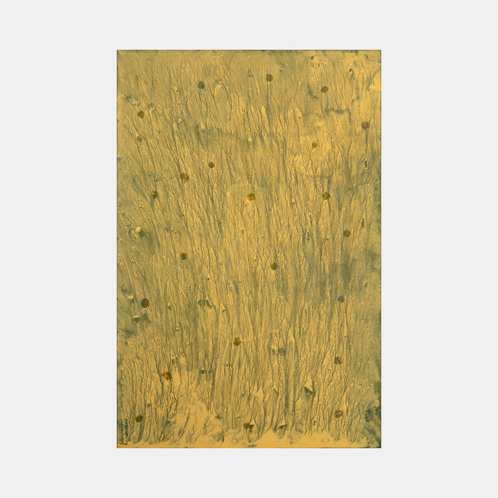 The artwork 'Biophilia 34' by George Stanojevic features vertical streaks of golden ochre pigment with scattered dark green dots throughout the canvas, creating an organic pattern reminiscent of tall grass or wheat fields. Natural elements and sunlight influence create subtle textural variations across the abstract composition. Created using pigment and mixed media on canvas by George Stanojevic.