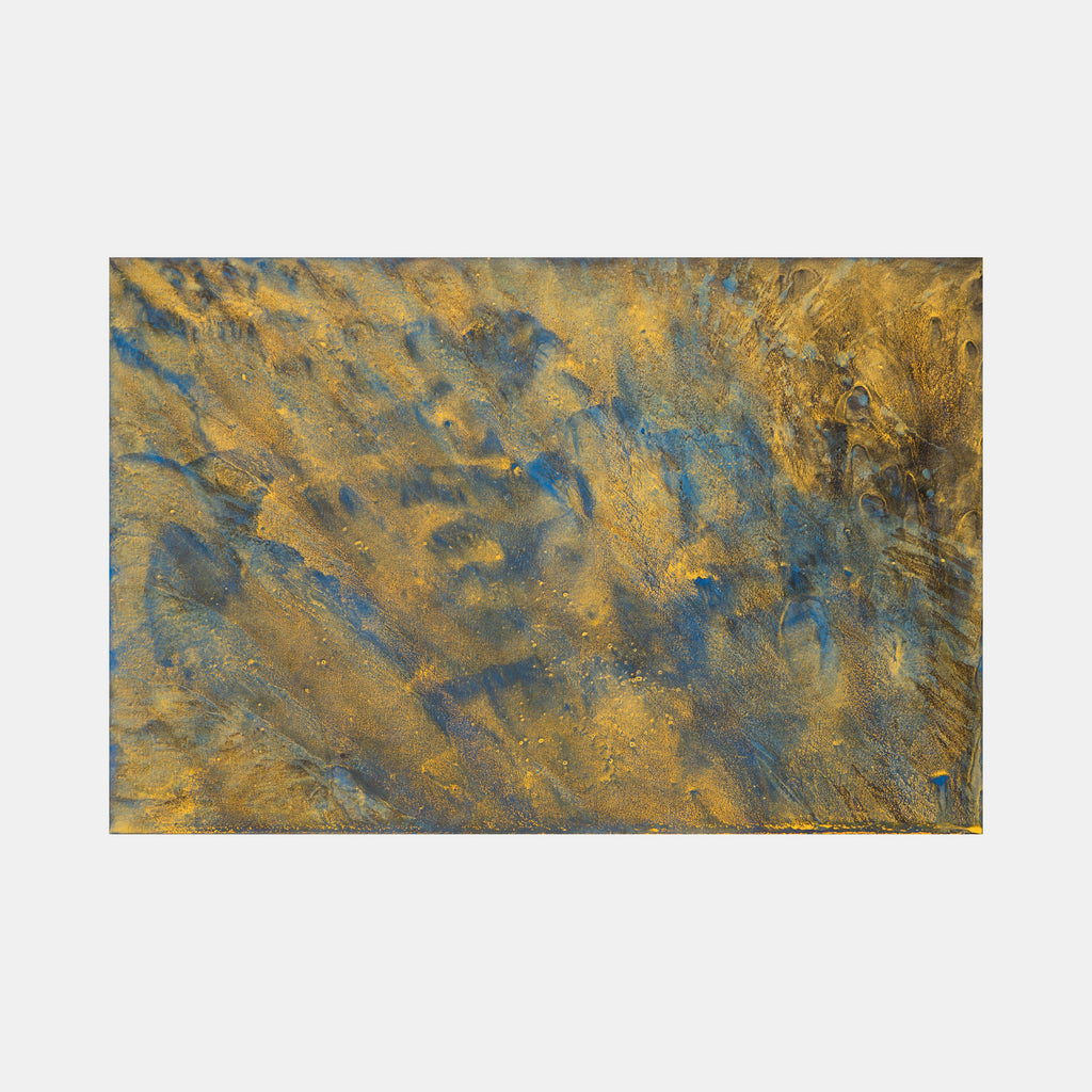 The artwork 'Biophilia 40' by George Stanojevic features a textured abstract composition with swirling patterns of metallic gold and deep azure blue. The surface appears weathered and organic, with natural erosion-like textures created through the interaction of pigments, sunlight, and water on canvas, creating a dynamic interplay of earth tones and celestial blues.