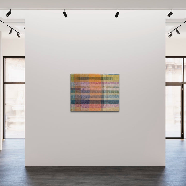 The artwork 'Untitled 155' by Victoria Manganiello features horizontal bands of interwoven fibers in soft pastel hues, including muted oranges, blues, and pinks. The textile piece showcases a delicate interplay of natural and synthetic materials, creating a translucent, grid-like pattern with subtle color transitions and layered textures. Displayed on a white wall, this 40x52-inch fiber art composition demonstrates masterful weaving techniques.