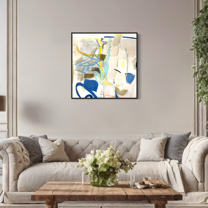 The artwork 'After Breakfast' by Jodi Fuchs features an abstract composition with dynamic brushstrokes in navy blue, soft yellow, and turquoise against a creamy white background. The painting showcases loose, gestural marks and organic shapes, creating a sense of movement and spontaneity across the 36x36 inch acrylic canvas.