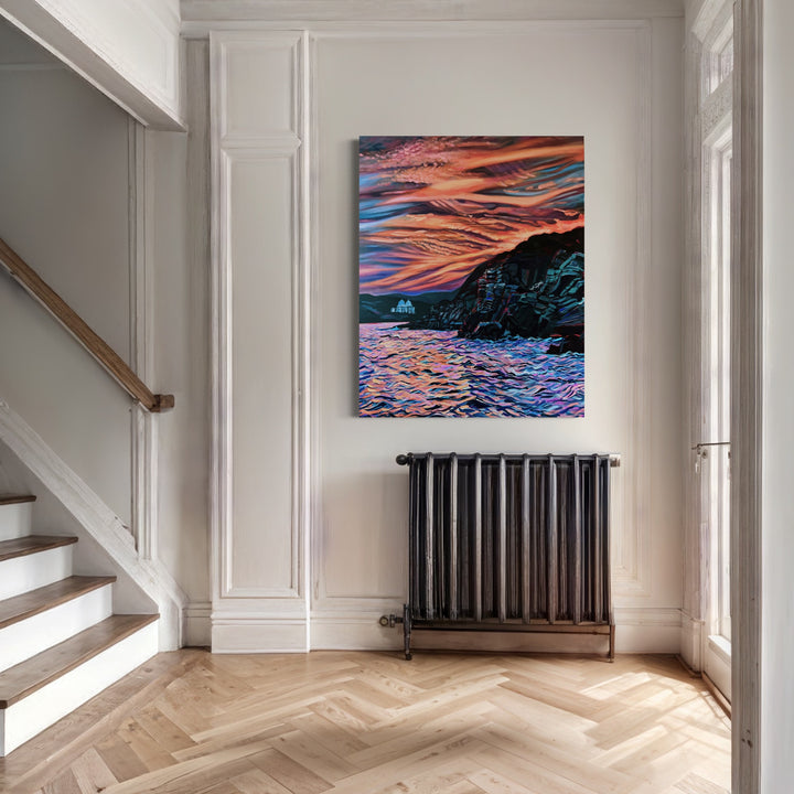 The artwork 'Ancestral Call' by Claudia Robles-Gil captures a dramatic coastal sunset with vibrant orange and pink streaked skies reflecting on rippling waters. Dark rocky cliffs frame the seascape, creating a striking contrast against the luminous sky. The oil and acrylic painting features bold brushstrokes and dynamic color transitions, measuring 60x48 inches.