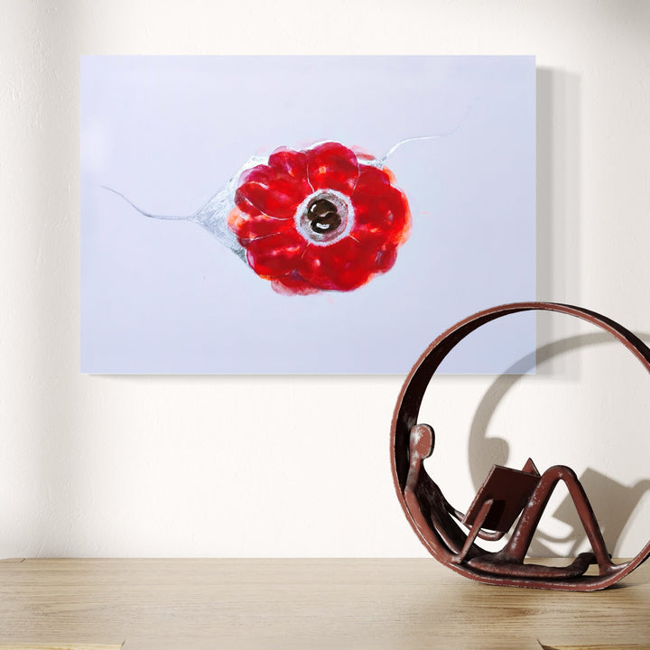 The artwork 'Anemone Coronaria' by Ronit Levin Delgado features a vibrant red flower rendered in lipstick and chrome paint against a soft white background. The delicate petals form a circular pattern around a dark center, with subtle metallic accents creating a luminous effect. The minimalist composition on archival paper captures the essence of botanical artistry.