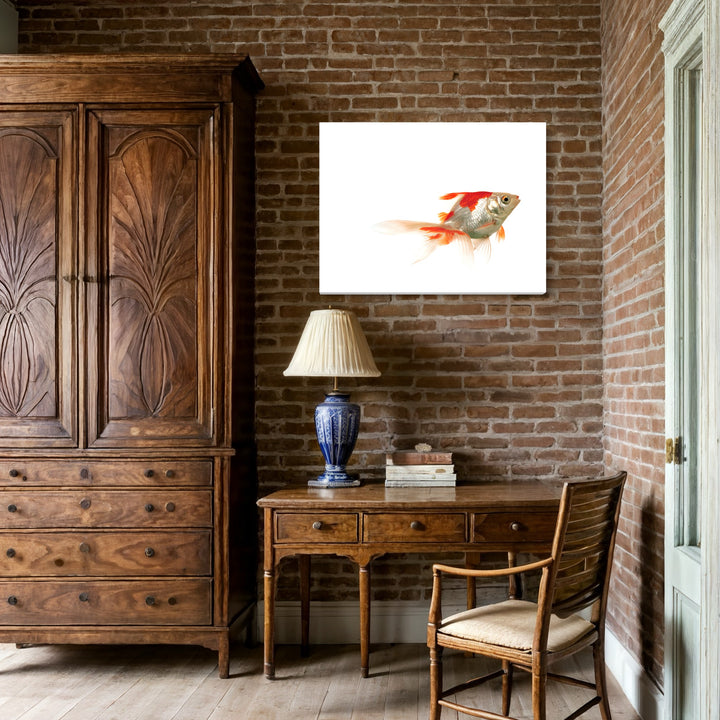 Beauty Credit Version 3.0^3 by Dirk Westphal features a striking watercolor-style fish artwork with vibrant orange and red hues against a pure white background. The minimalist composition captures a goldfish in motion, its fins trailing like flames, creating a sense of fluid movement. Displayed in a contemporary room setting with exposed brick walls and classic furniture.