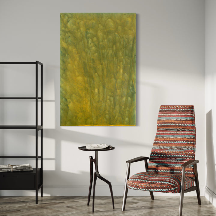 The artwork 'Biophilia 32' by George Stanojevic features an abstract expressionist composition in yellow and green hues, suggesting organic forms rising vertically like bamboo stalks or tall grass. The natural pigments create a textured surface with subtle gradients and watercolor-like effects, embodying the interaction between sunlight and natural elements on canvas.