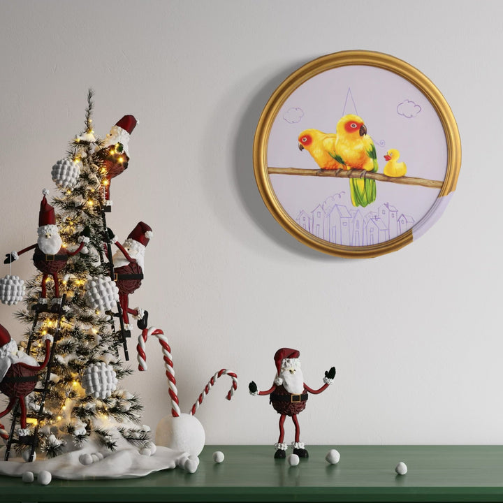 The artwork 'Birthday Surprise' by Carlos Gamez de Francisco features three vibrant yellow lovebirds perched on a wooden branch against a white background, framed in a circular gold frame. Simple pencil sketches of clouds and a cityscape appear below the birds. The 16x16 inch acrylic painting combines whimsical realism with delicate line drawing elements.