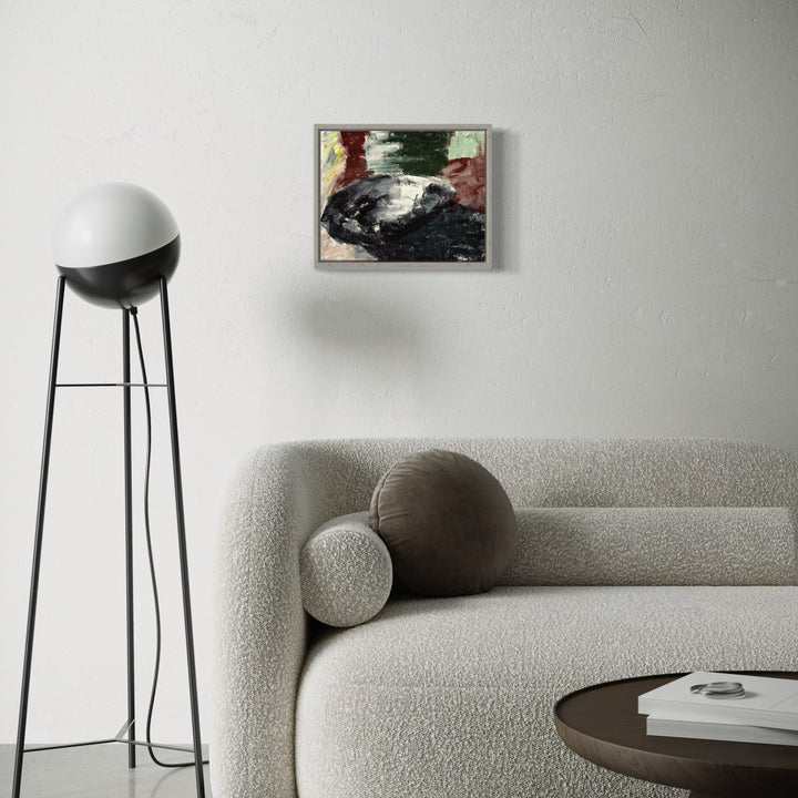 A photo of the artwork Black Bowl, by Todd Gilens, hanging on a wall.