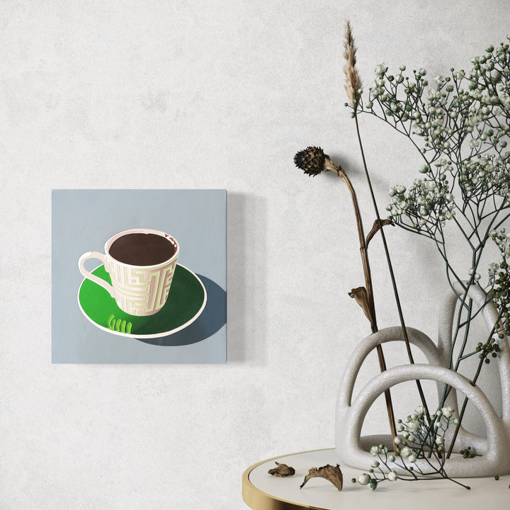 The artwork 'Black Coffee 15' by Lori Larusso features a minimalist illustration of a white coffee cup filled with black coffee, set on a bright green saucer against a soft blue-gray background. The painting employs clean lines and sharp shadows, rendered in acrylic and enamel on a 10x10 inch wood panel, showcasing a pop art aesthetic.