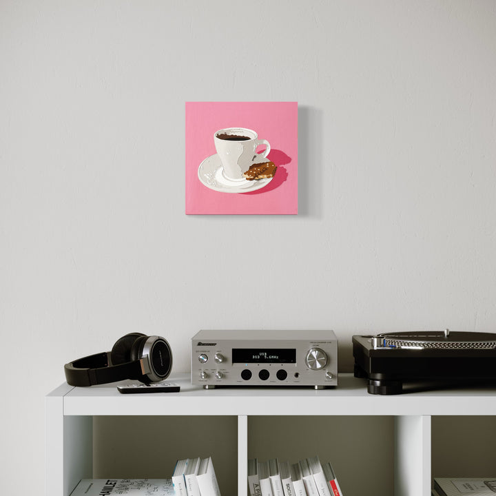 The artwork 'Black Coffee 20' by Lori Larusso features a minimalist composition of a white ceramic coffee cup and saucer against a vibrant pink background. The cup contains dark black coffee and is accompanied by what appears to be a small cookie or biscuit. Created with acrylic and enamel on a 10x10 inch cradled wood panel.