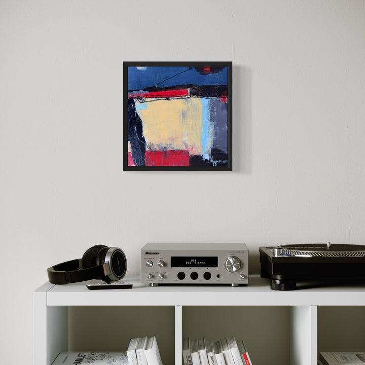 The artwork 'Boundaries of Light' by Karen L. Burns features bold abstract geometric shapes with deep charcoal contrasting against soft golden yellows, vibrant reds, and calming blues. The acrylic painting's minimalist composition creates dynamic intersecting planes, showcasing a modern interplay of light and shadow framed in sleek black.