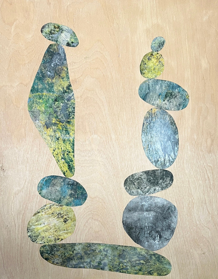 The artwork 'Cairn For John' features abstract stacked stones in blue-grey and chartreuse hues, created through acrylic and alchemic print collage on wood panel. Two balanced compositions of oval and elongated shapes rise vertically against a warm beige background, suggesting zen-like rock formations. By Sunny Chapman.