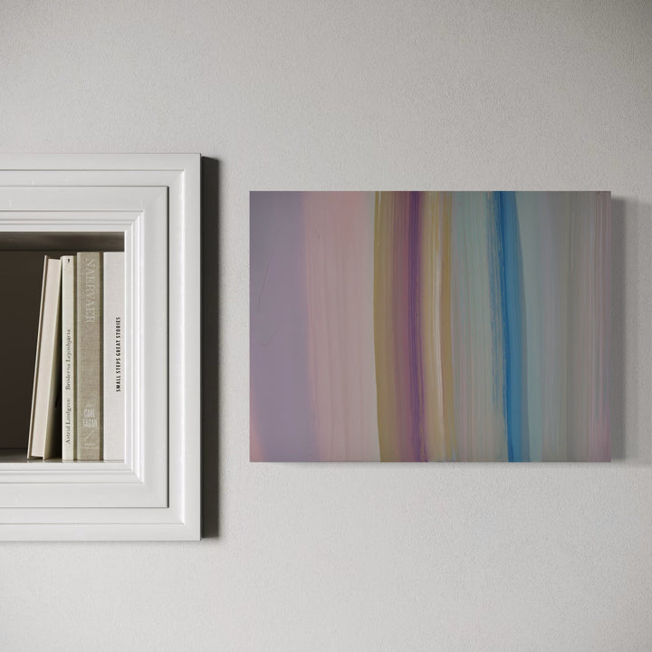 The artwork 'Carrying and Soaring 15' by Willy Bo Richardson features vertical bands of soft pastel colors transitioning from muted purple to cream, with a distinctive blue stripe. The abstract composition on wood panel showcases smooth brushstrokes in acrylic and oil, creating a serene gradient effect that spans 12 x 16 inches.