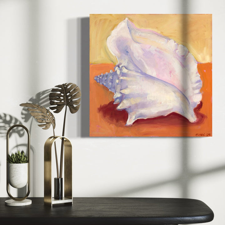 The artwork 'Conch' by Cristi Lyon features a luminous white seashell rendered in oil on canvas, set against a warm orange and golden background. The conch shell displays delicate purple and pink undertones, with intricate spiral patterns and textural details characteristic of marine specimens. The contemporary composition showcases masterful light and shadow play, creating a striking contrast between the shell's organic form and the vibrant back