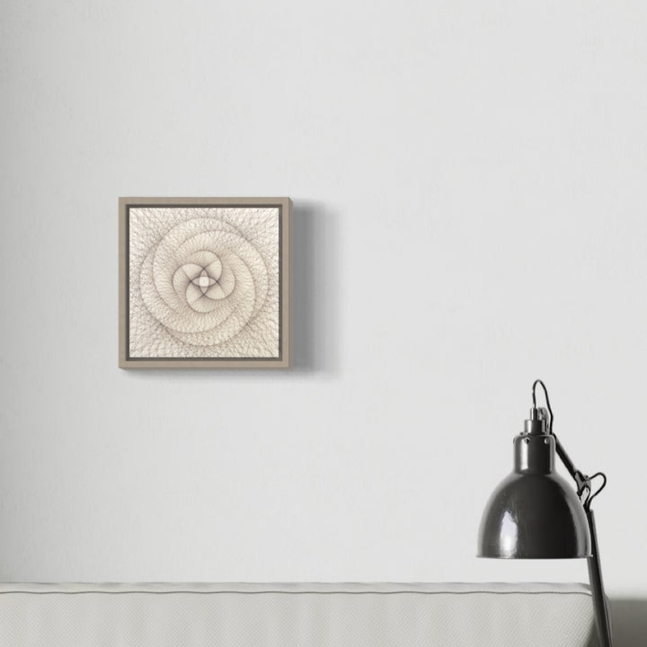 The artwork 'Empty Void 30' by Jayoung Yoon features a delicate spiral pattern crafted from human hair and acrylic medium on an 8x8 inch panel. The circular design creates a mesmerizing mandala-like formation in ivory white, housed in a minimalist taupe frame. The textural piece exhibits intricate weaving patterns radiating from a central point in a geometric swirl by Jayoung Yoon.