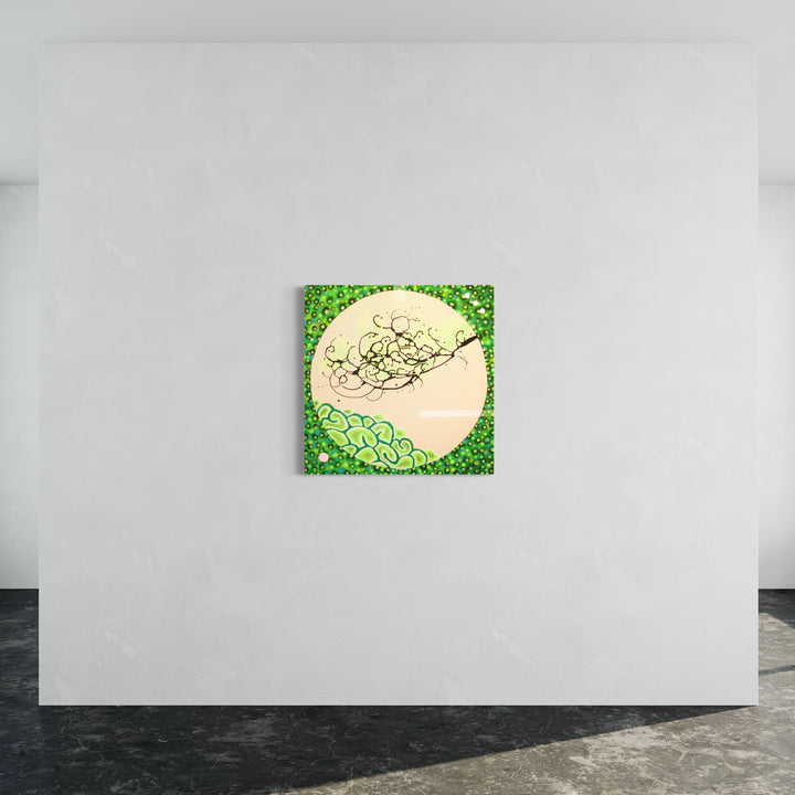 The artwork 'Environmentality' by Eric Jiaju Lee features a luminous cream-colored circular form set against a vibrant green background. Abstract swirling patterns in black dance across the pale orb, while intricate organic patterns in varying shades of green create a textured border, suggesting natural forms and environmental harmony. Acrylic on canvas, 38x38 inches, by Eric Jiaju Lee.