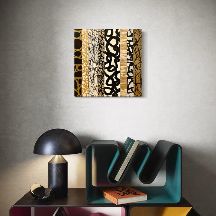 The artwork 'Equinimity' by Nicole Hitchcock features vertical bands of abstract patterns in black and gold, creating a striking geometric composition. The mixed-media collage, sealed in resin, combines organic and structured motifs including cellular shapes, intricate line work, and tribal-inspired designs in a harmonious 24x24 inch format.