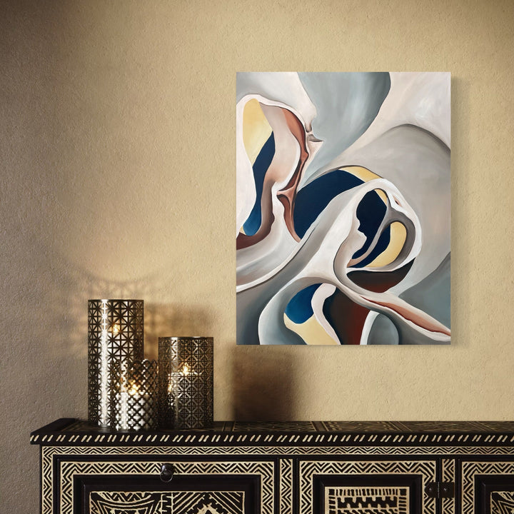 The artwork 'Fossil Artery' features flowing abstract curves in a harmonious blend of navy blue, soft gray, and cream tones. The oil painting showcases organic, wave-like forms that intertwine across the canvas, creating a dynamic composition reminiscent of natural geological formations. The smooth transitions between colors and fluid shapes evoke a sense of movement and depth. By Meam Hartshorn.