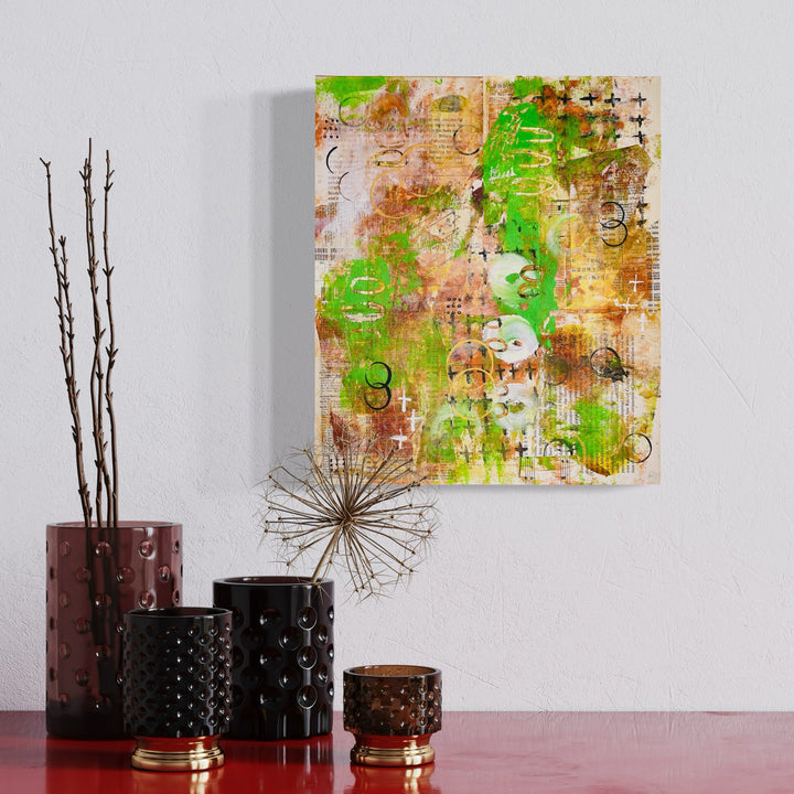 A photo of the artwork Green Palimpsest, by Alexandra Jamieson, hanging on a wall.