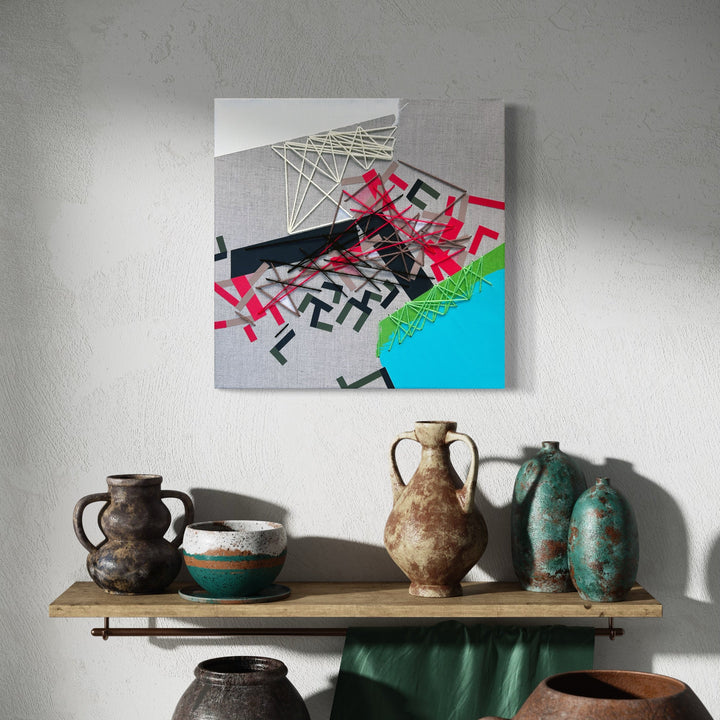 The artwork 'Haabbeller' by Philippe Halaburda features abstract geometric patterns with intersecting white yarn lines, bold pink and black angular shapes, and a vibrant turquoise accent on a light gray canvas. Mixed media composition combining acrylic paint, tape, and yarn creates dynamic movement and spatial depth in this 20x20 inch contemporary abstract artwork by Philippe Halaburda.