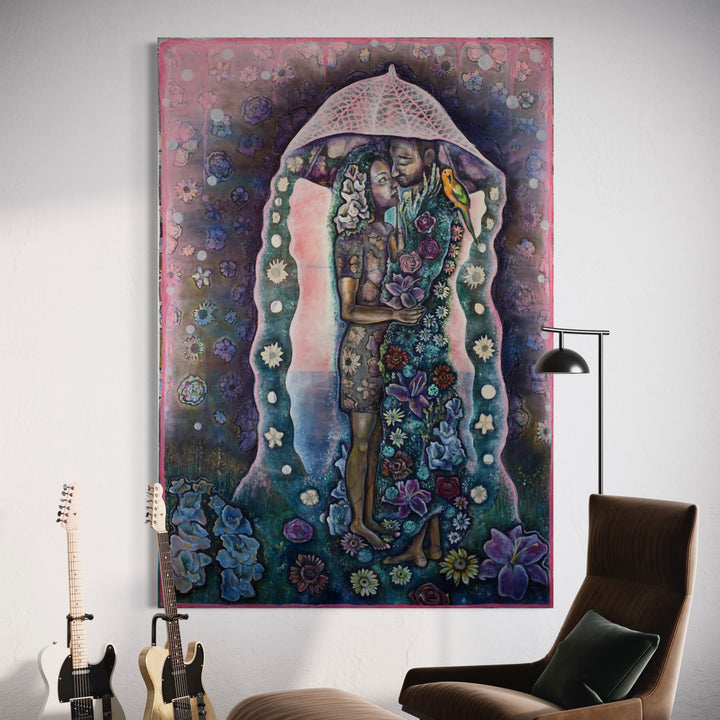 The artwork 'Healers' by Laurie Shapiro features a figure beneath a dome-like umbrella structure, surrounded by intricate floral patterns in blues and purples. The mixed-media piece combines screen-printed drawings with hand-sewn details on muslin, creating a mystical atmosphere with a rich color palette of turquoise, pink, and deep indigo. Delicate white flowers line the edges, while botanical motifs fill the composition.