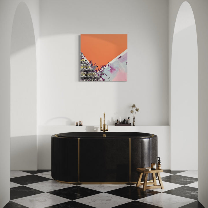 The artwork 'Hlf Asstluyu' by Philippe Halaburda features an abstract mixed media composition with a striking coral orange geometric section contrasting against soft pink and gray undertones, displayed in a modern bathroom setting with a luxurious black oval bathtub and checkered marble floor, 36x36 inches.