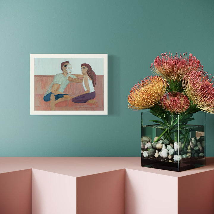 The artwork 'Hyde Always Wins' by Ali Ha depicts a romantic scene with two figures seated in conversation on a soft coral-colored surface. The oil painting on canvas features gentle, muted pastel tones, with a minimalist composition style. The 11x14 inch artwork showcases delicate brushwork and an intimate atmospheric quality.