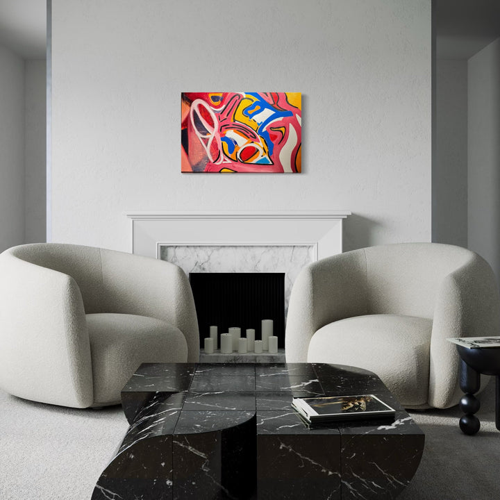 The artwork 'Interconnectedness' by Genevieve Antonello features vibrant abstract shapes in red, blue, and yellow flowing together in dynamic curves and swirls. The oil painting on canvas creates a bold, energetic composition against a white wall, displayed above a marble fireplace in a modern living space. The piece showcases fluid movement and organic forms. By Genevieve Antonello.