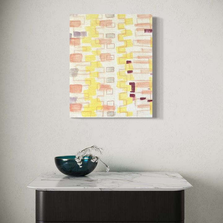 The artwork 'Light A Candle-7' by Cora Jane Glasser features a geometric abstract pattern of rectangular shapes in soft yellow, peach, and white tones arranged in vertical columns. Oil on linen canvas mounted on wood panel, the composition creates a gentle, rhythmic mosaic effect with translucent brushstrokes and delicate color transitions. 20x16 inches by Cora Jane Glasser.