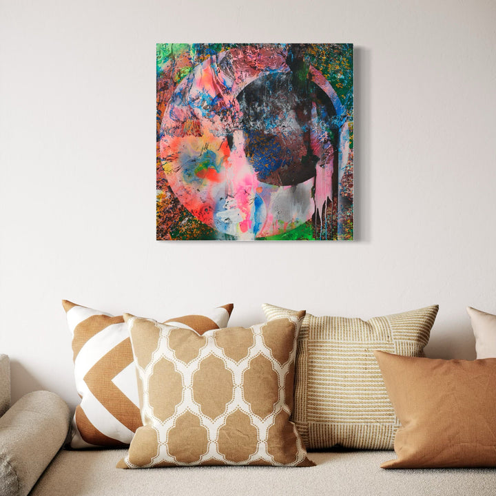 A photo of the artwork Mirror Eye with Black Hole, by Millie Benson, hanging on a wall.