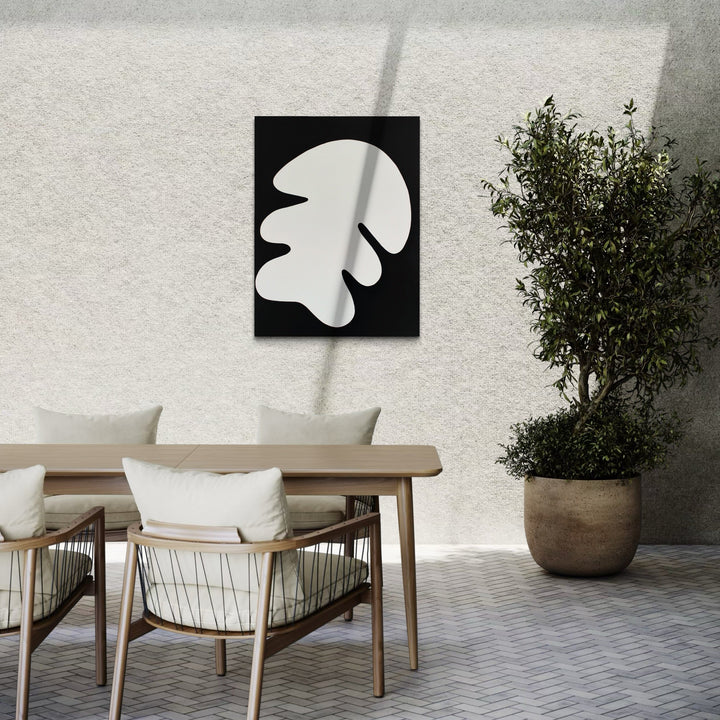 The artwork 'Nature II' by Shadia Sabagh features a stark black and white composition with an organic leaf-like shape in white against a deep black background. The minimalist abstract design creates a bold contrast and organic flowing form reminiscent of botanical elements, painted in acrylic on canvas measuring 48x36 inches. By Shadia Sabagh.