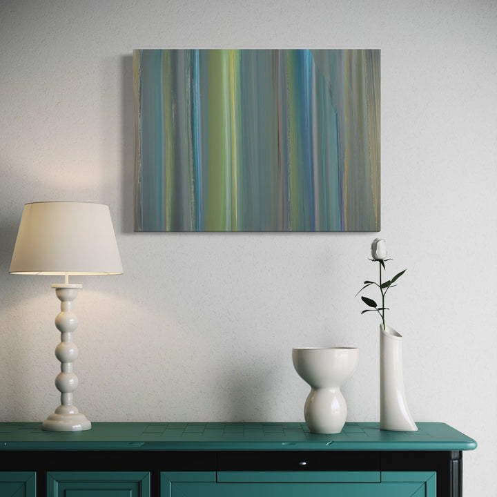 The artwork 'Navigation 6' by Willy Bo Richardson features vertical brushstrokes in serene shades of blue, green, and yellow creating a tranquil striped pattern. The oil on paper painting showcases smooth color transitions and ethereal waterfall-like effects, with subtle variations in opacity and luminosity throughout the 22x30 inch composition. By Willy Bo Richardson.