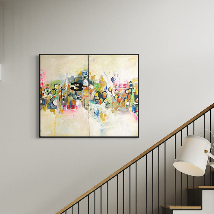 The artwork 'Oh Yes diptych' by Jodi Fuchs features a vibrant abstract composition split across two canvases. Playful brushstrokes in pink, blue, yellow, and green dance across a cream-colored background, with the word 