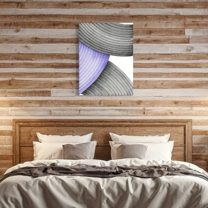 The artwork 'Petrichor' by Alina Glotova features a minimalist composition with curved lines creating elegant abstract forms. Gentle gray concentric arcs intersect with a soft lavender curved segment against a crisp white background, embodying a modern aesthetic through printInk marker technique. 40x30 inches wall art displayed above wooden bed frame.