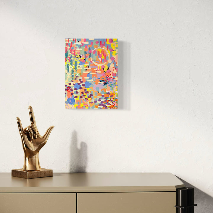 A photo of the artwork Pixel Rainbow 1, by Alexandra Jamieson, hanging on a wall.