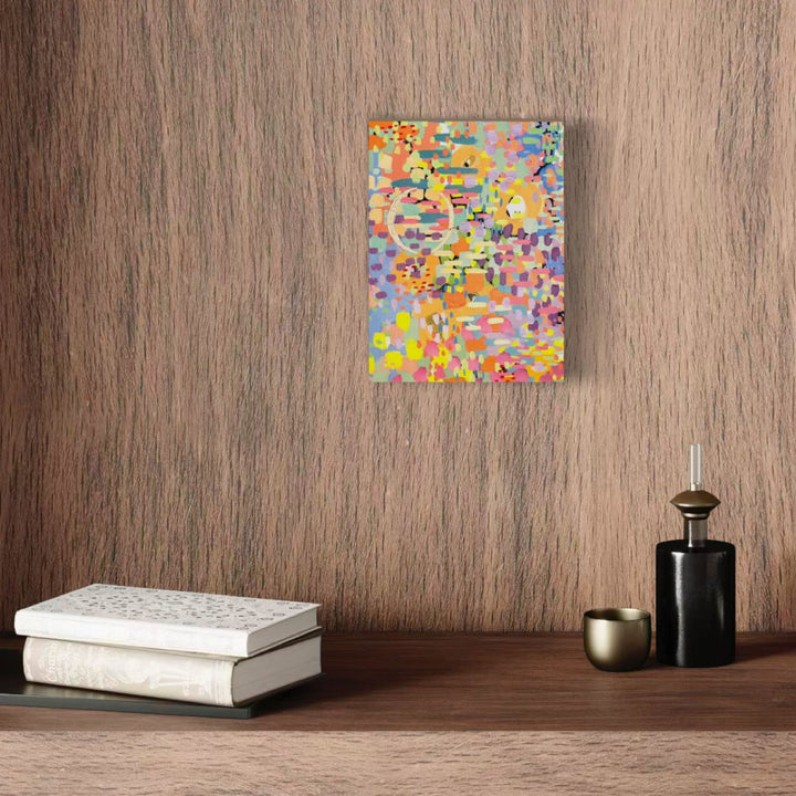 A photo of the artwork Pixel Rainbow 3, by Alexandra Jamieson, hanging on a wall.