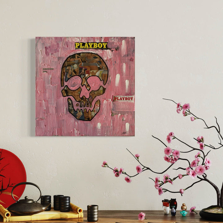 The artwork 'Playboy' by Jean-Remi Barbier features a striking skull design against a textured pink background. The skull incorporates camouflage patterns in brown and olive tones, with Playboy branding elements. The 24x24 inch mixed media piece showcases bold brushstrokes and acrylic textures, creating a contemporary pop art aesthetic.