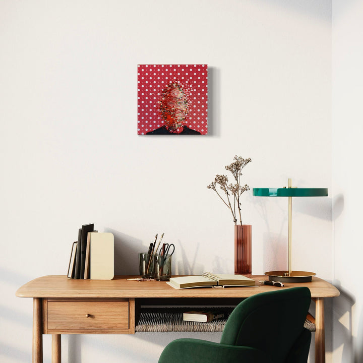 A photo of the artwork Red Pop, by Matthew Cramer, hanging on a wall.