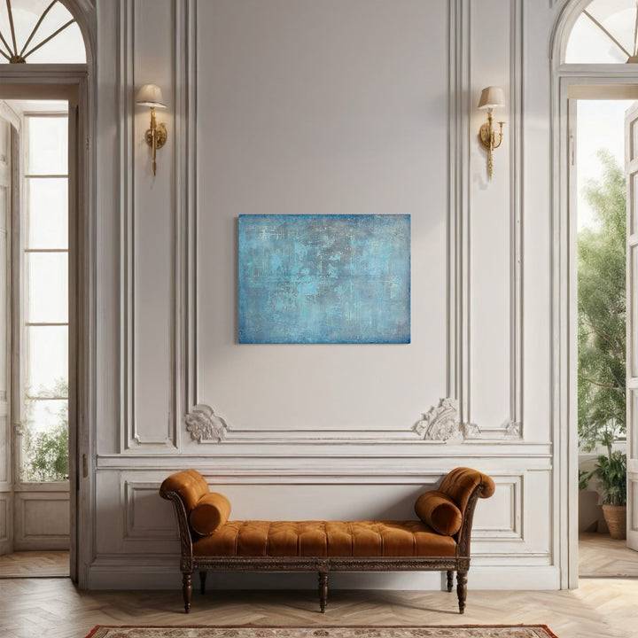 The artwork 'Reflection' by Nicole Hitchcock features a serene abstract composition in vibrant aqua blue with textural elements creating a weathered, atmospheric effect. The acrylic painting displays varying shades of turquoise with subtle grey undertones, reminiscent of calm waters. The 48x36 inch canvas showcases a minimalist style with layered brushstrokes and distressed surface details that add depth and contemplative quality to the piece.