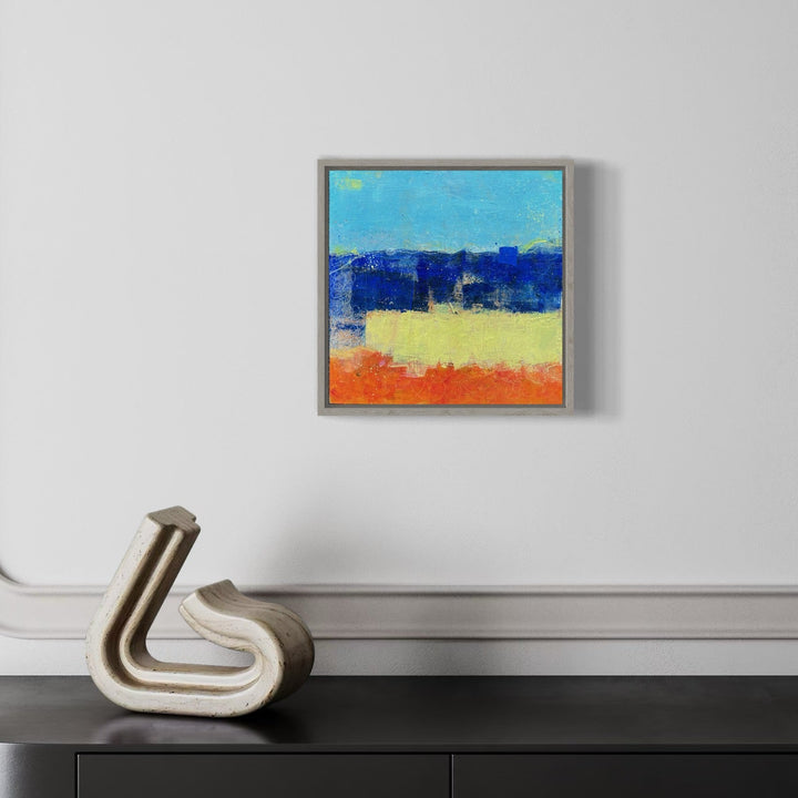 A photo of the artwork Sapphire Sunset, by Karen L. Burns, hanging on a wall.