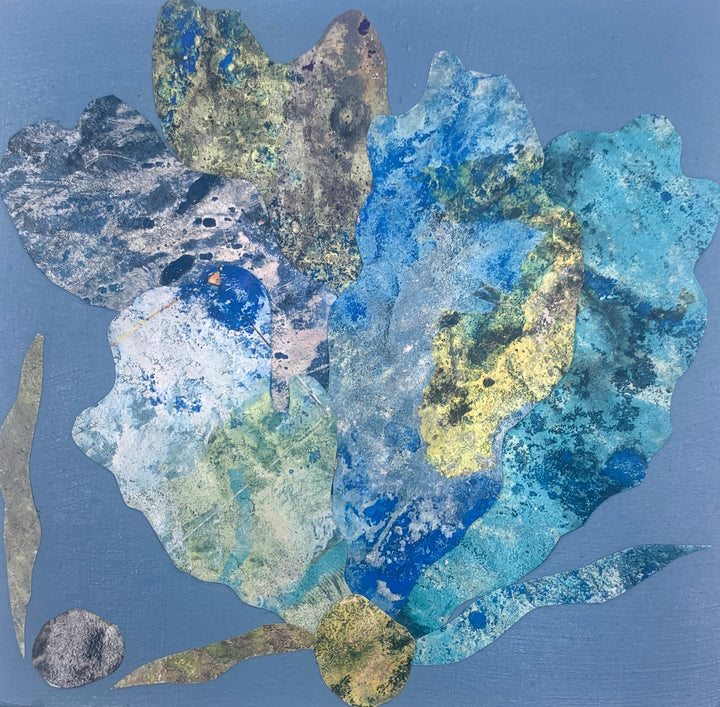 The artwork 'Sea Fan 4' by Sunny Chapman features an abstract marine-inspired collage on a blue background. A delicate fan-shaped form in shades of turquoise, cobalt blue, and golden yellow creates a textured coral-like pattern. Alchemic prints and acrylic textures blend seamlessly on the wood panel, capturing the ethereal beauty of underwater life.