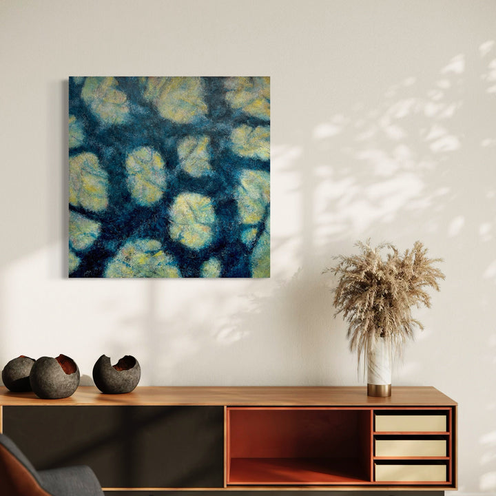 A photo of the artwork Shadow Play, by Cynthia Sumner, hanging on a wall.