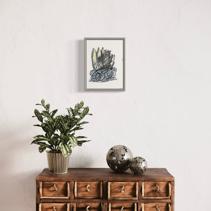 A photo of the artwork Small Arrangement II, by Todd Gilens, hanging on a wall.