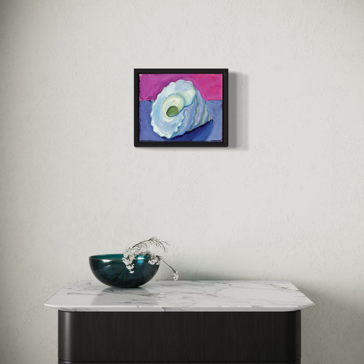 The artwork 'Spiral Shell' by Cristi Lyon features a luminous seashell rendered in oil on paper, showcasing soft blue and white tones against a vibrant pink background. The shell's spiral form is captured with delicate brushwork, emphasizing its natural curves and inner chamber with subtle green accents, presented in a sleek black frame - by Cristi Lyon.