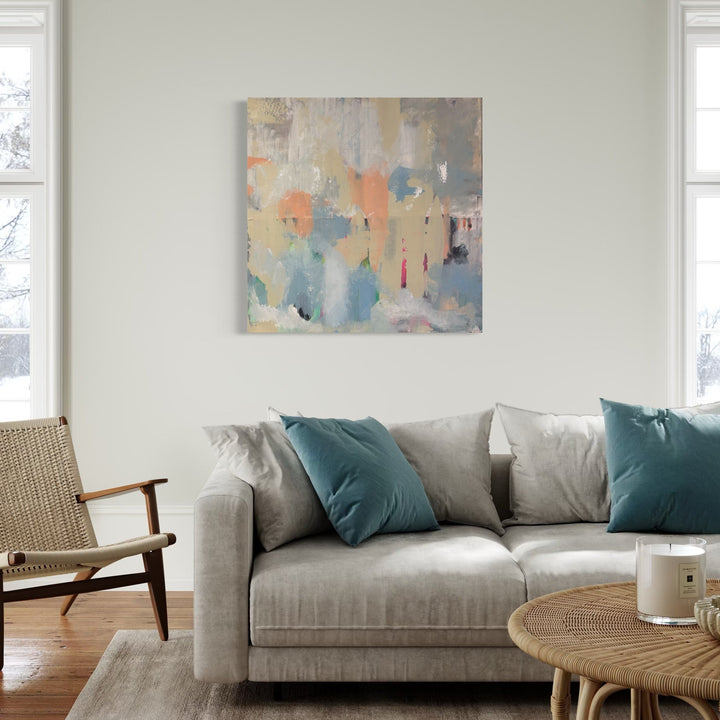 The artwork 'Spring's Meadow' by Tammy Kushnir features ethereal brushstrokes in soft pastel hues of peach, turquoise, and cream. Abstract expressionist composition with layered mixed media creates a delicate, atmospheric effect reminiscent of a misty spring morning. The 36x36 inch canvas showcases fluid, organic shapes with subtle textural elements and gentle color transitions.