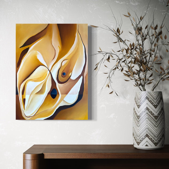 The artwork 'Sun Drop' by Meam Hartshorn features abstract flowing forms in warm golden yellows and crisp whites, creating a dynamic composition reminiscent of liquid sunlight. The oil painting on panel showcases organic curves and graceful lines, with subtle dark accents adding depth and movement to the 18x24 inch piece.