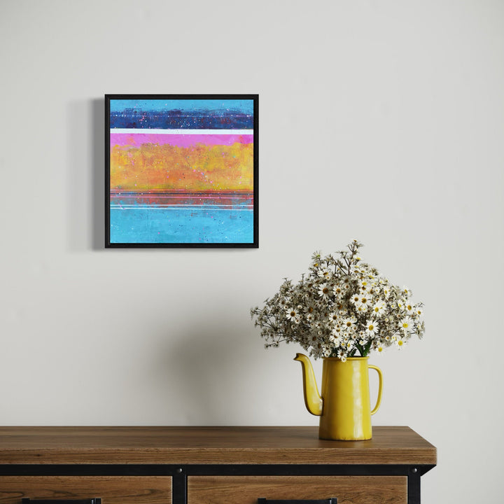 A photo of the artwork Sunset Sparkles, by Karen L. Burns, hanging on a wall.