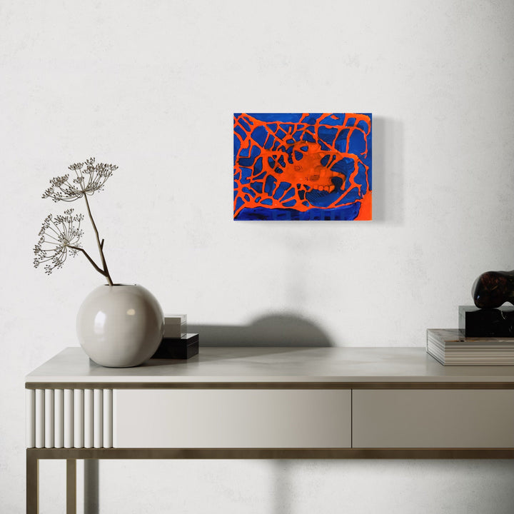 The artwork 'The Bones of Orange Luminescence' by Devin Ruiz features vibrant abstract composition with contrasting electric blue background and bright orange organic lines creating a web-like pattern. The acrylic painting on canvas showcases dynamic movement through interconnected curved strokes, resembling glowing skeletal forms against a deep cobalt backdrop.