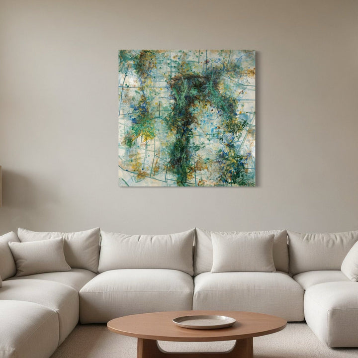 The artwork 'The Cross We Bear' by Lisa Petker Mintz features an abstract expressionist composition in turquoise, emerald, and white. Dynamic brushstrokes create a central cross-like formation amid layers of textured acrylic paint. Ethereal splashes and drips evoke a sense of movement across the 48-inch square board, with subtle golden accents throughout the atmospheric piece.